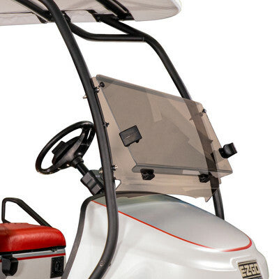 EZGO tinted folding windshield mounted on TXT golf cart